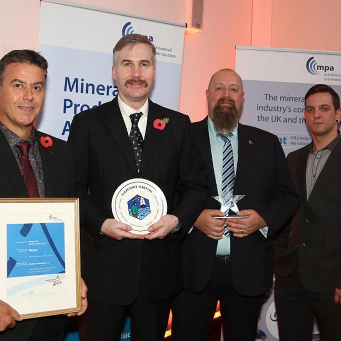 Pictured with the TUC Trophy for worker involvement are, from left, Needingworth unit manager Hilton Law, weighbridge operator Simon Downing, general foreman Ian Ballard and plant operator Chris Ivatt. 